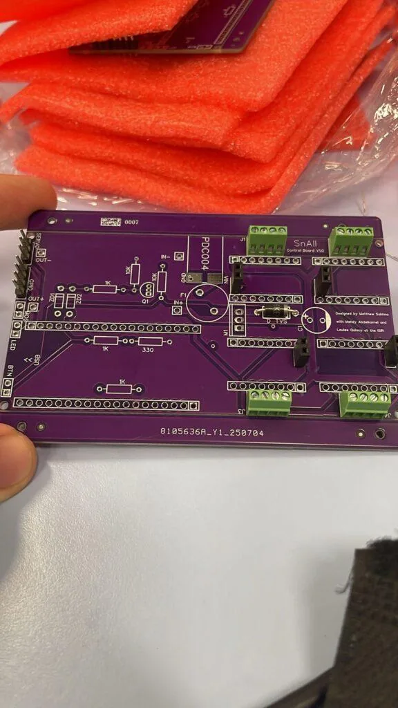 Finished Sn.AI.l PCB and robot assembly